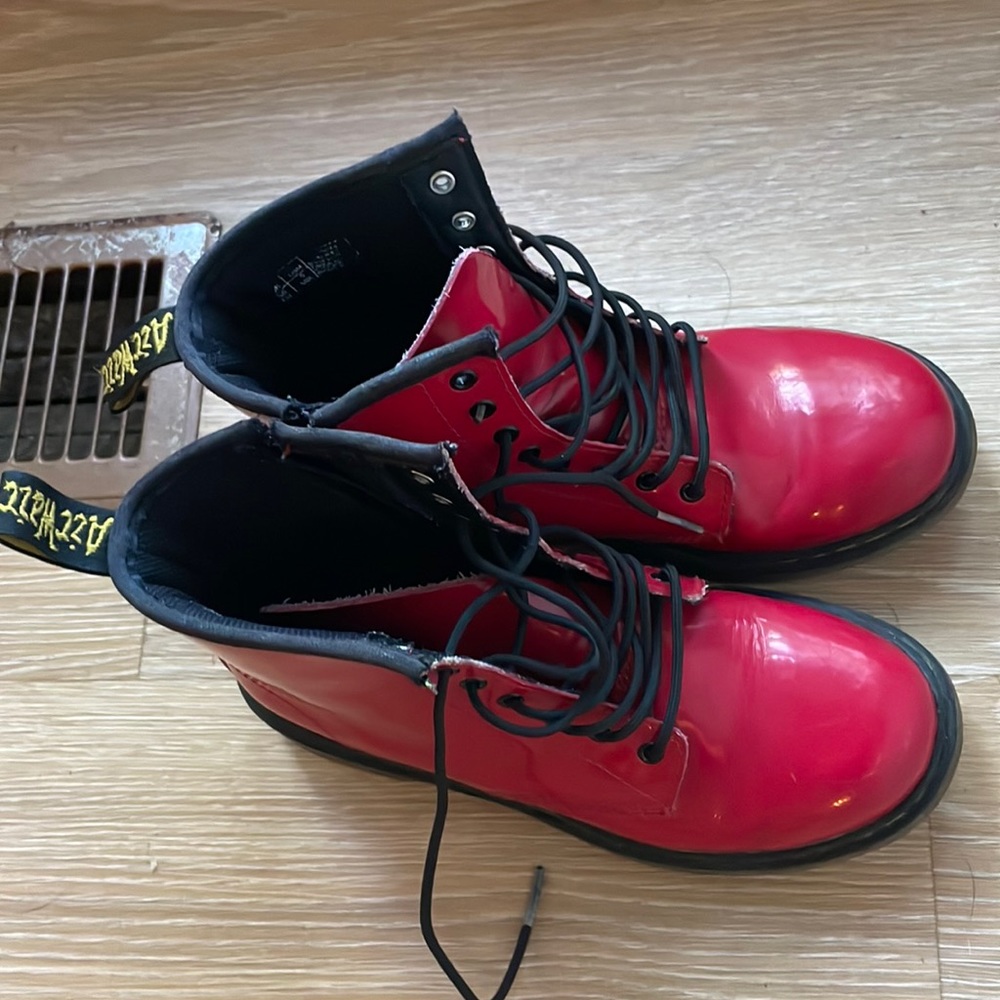 Red patent leather Dr. Martin combat boots with zipper